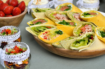 A set of beautiful canapes on a table with a gray tablecloth. Buffet table. Catering