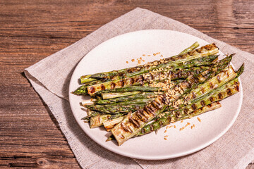 Ripe grilled asparagus. Wooden cutlery, healthy food concept