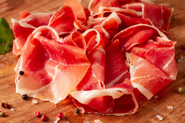 Sliced Prosciutto Parma, Italian delicacy, top view, horizontal, no people,