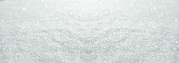 Snow crystals on soft winter backround. Horizontal close-up with short depth of field and space for...