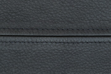 Black leather texture, part of the jacket. Leather jacket texture. 