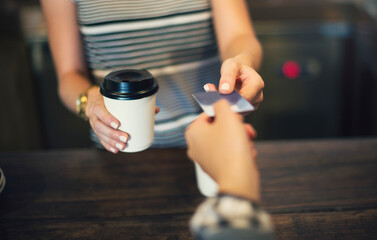 Fototapeta na wymiar Customer paying coffee with credit card