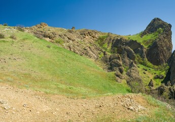 Fototapeta na wymiar Spring panoramic landscape on Karadag volcanic mountain range located in Crimean peninsula