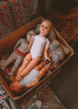 Vintage spooky dolls in box. Old style creepy toys