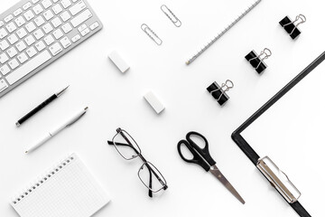 Trendy white office desk table with computer keyboard. Top view