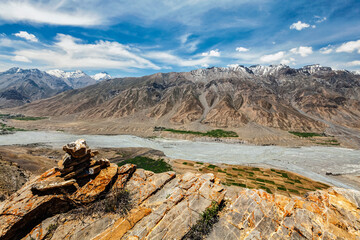 View of Spiti valley Himalayas with stone cairn . Spiti valley, Himachal Pradesh, India