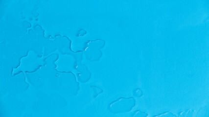 A water drop on a blue background.