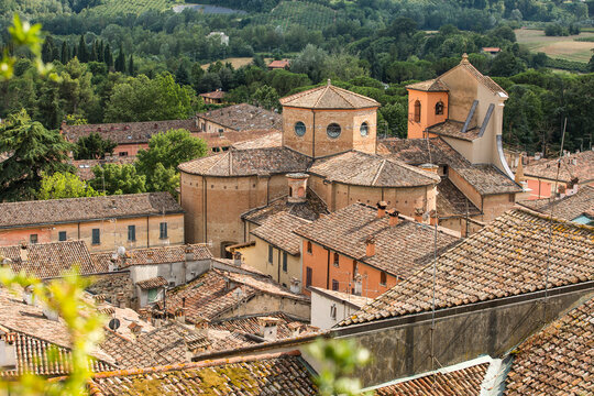 Brisighella, Ravenna, Emilia-Romagna, Italy. Aerial view of tiled rooftops and church of San Michele Arcangelo