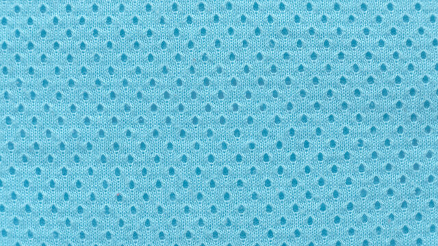A Blue Fabric Texture Of An Eyelet Baby Cloth.