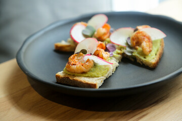 Bruschetta with shrimps and avocado