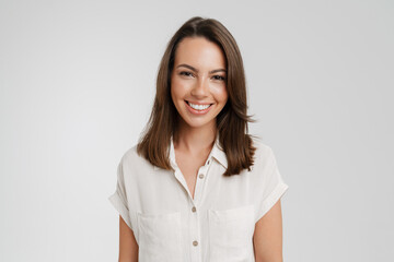 Young european woman in shirt smiling and looking at camera