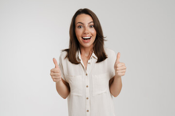 Young european woman laughing and showing thumbs up