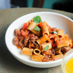 Pasta with braised duck and tomatoes