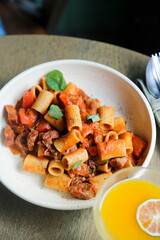 Pasta with braised duck and tomatoes