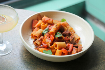 Pasta with braised duck and tomatoes