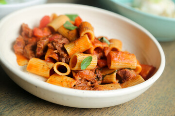 Pasta with braised duck and tomatoes
