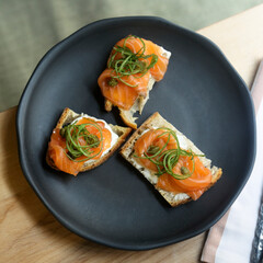 Healthy bruschetta with salmon and cream cheese