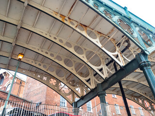 Support struts and posts underneath an old cast iron bridge built in 1834 - obrazy, fototapety, plakaty