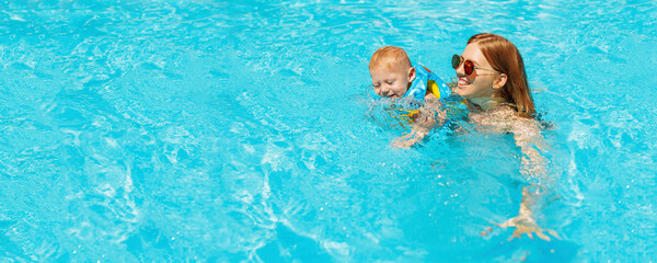 mom and little baby swim in the pool, Happy baby learn to swim, dive underwater with fun in the pool, mom teaches her little child to swim