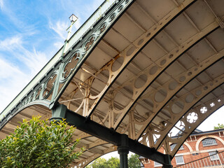 Support struts and posts underneath an old cast iron bridge built in 1834 - obrazy, fototapety, plakaty