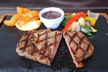Delectable Medium Grilled Tenderloin Steak on Hot Stone Plate	