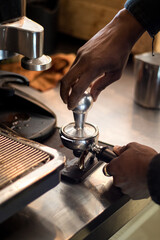 Fototapeta na wymiar black barista making coffee