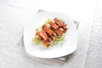 deep fried pork belly with garlic meat in white background asian halal menu