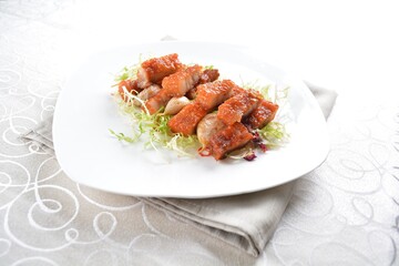 deep fried pork belly with garlic meat in white background asian halal menu