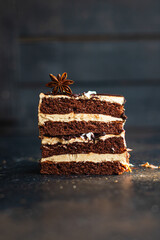 piece of cake chocolate cream nuts, coffee syrup flavor spices, honey, ganache sweet dessert holiday treat meal snack copy space food background rustic