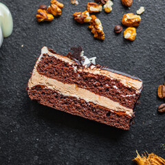 piece of cake chocolate cream nuts, coffee syrup flavor spices, honey, ganache sweet dessert holiday treat meal snack copy space food background rustic
