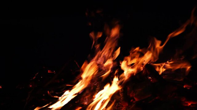 fire and flames. Flames and burning sparks close up, fire patterns. flames from the fire. Night bonfire, logs are on fire, sparks fly. .