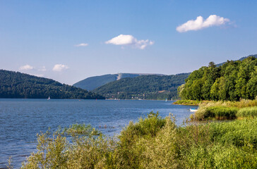 View on the Żywieckie Lake and the Żar Mountain in the background on a sunny afternoon
