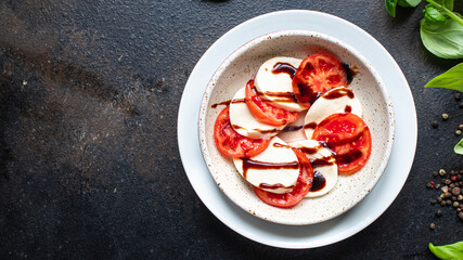 caprese salad mozzarella cheese, tomato basil leaf italian snack copy space food background rustic. top view keto or paleo diet veggie vegetarian food