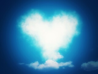 空に浮かぶハート形の雲のイラスト