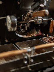 Coffee roasting machine with containers for beans