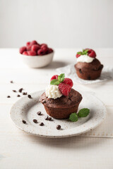 Delicious cupcakes with fresh berries. Muffin with raspberry and chocolate. Close up