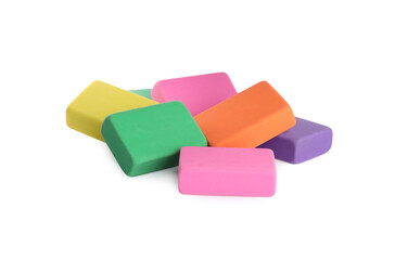Pile of bright erasers on white background