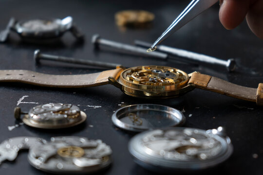 Mechanical watch repair. Watchmaker repairs vintage mechanical watches. Watchmaker's workshop. - Powered by Adobe