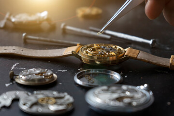 Mechanical watch repair. Watchmaker repairs vintage mechanical watches. Watchmaker's workshop.
