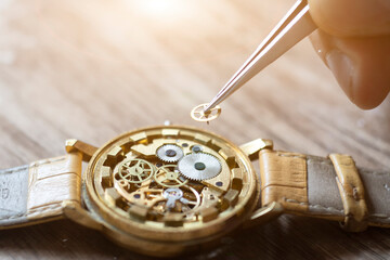 Mechanical watch repair. Watchmaker repairs vintage mechanical watches. Watchmaker's workshop.