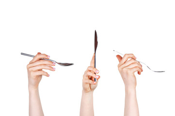 Spoon, fork and knife held by hands on white isolated background. Food and restaurant items. Concept of hands and body.