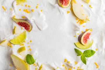 Whipped cream from egg whites with berries of figs, pears, lemon.