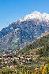 Fototapeta na wymiar Panoramic view of Merano in Italy with mountains in background.