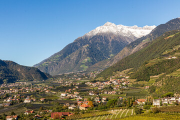 Naklejka na ściany i meble Panoramic view of Merano in Italy with mountains in background.