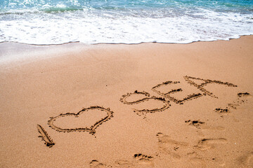 Inscriptions on the sand. I love the sea