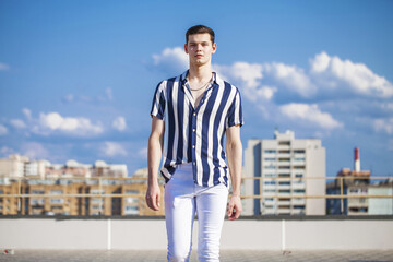 Fototapeta premium Fashion portrait of a young brunette man