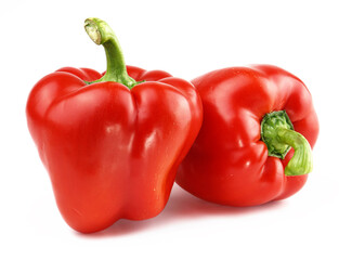Two big red bell peppers isolated on white background.