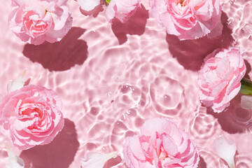 Top view of pink transparent clear calm water surface. Texture with splashes and bubbles and podium...