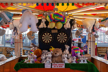 A typical fairground game where you can win a teddy by throwing darts at Clarence pier southsea