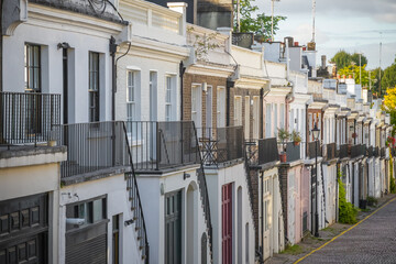 Terraced houses on cobbled Holland Park Mews in London, England
